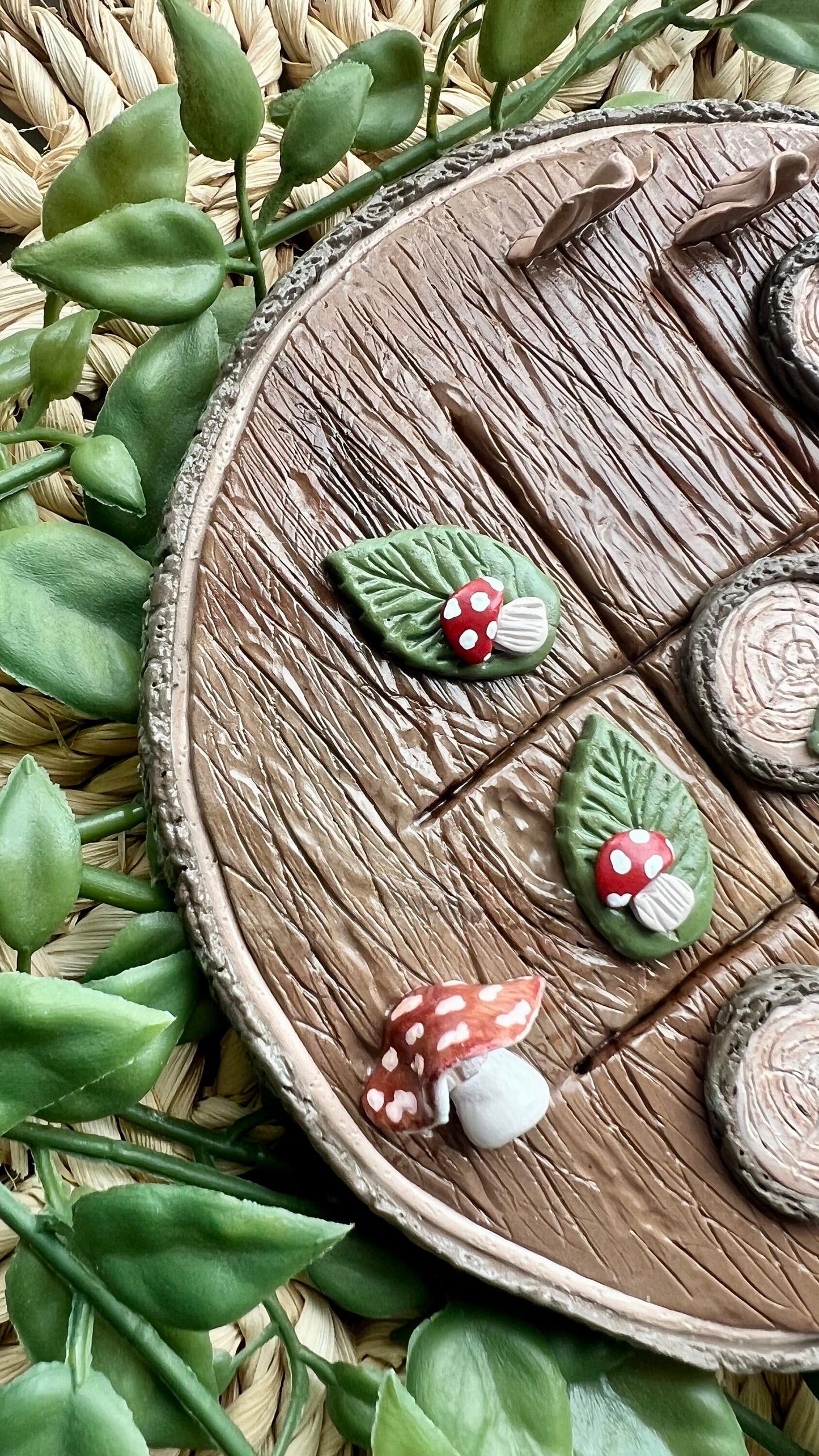 Polymer clay tic tac toe board with tree slice and mushroom pieces