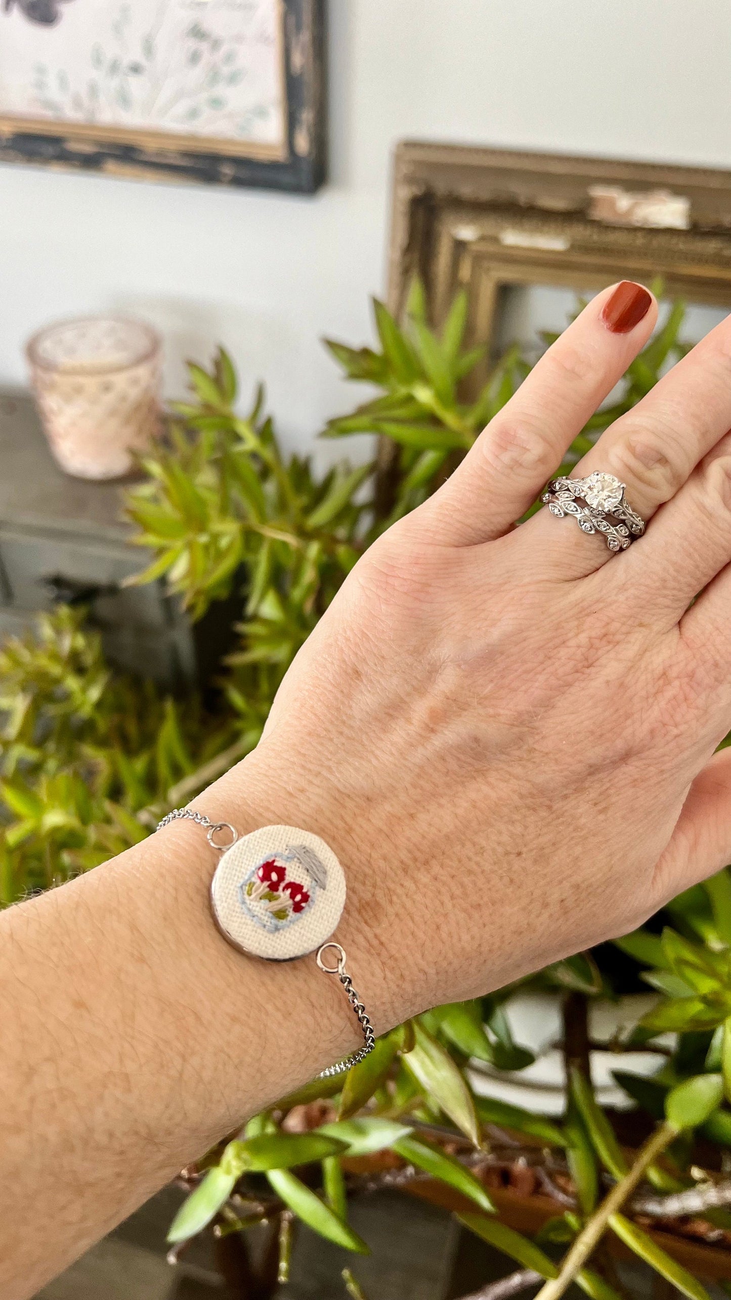 Embroidered mushroom in a jar set in a round bezel silver bracelet