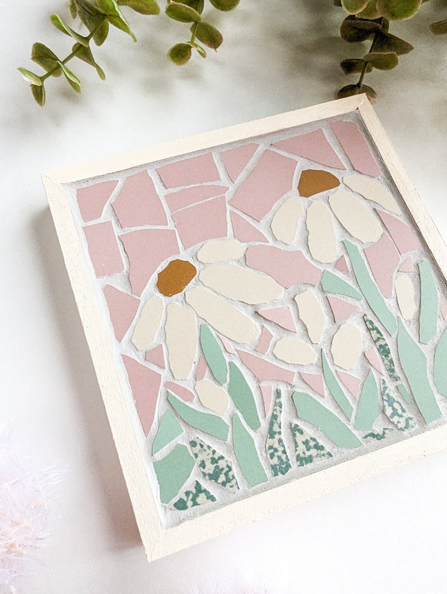 Off white daisy mosaic with a pink background wall hanging