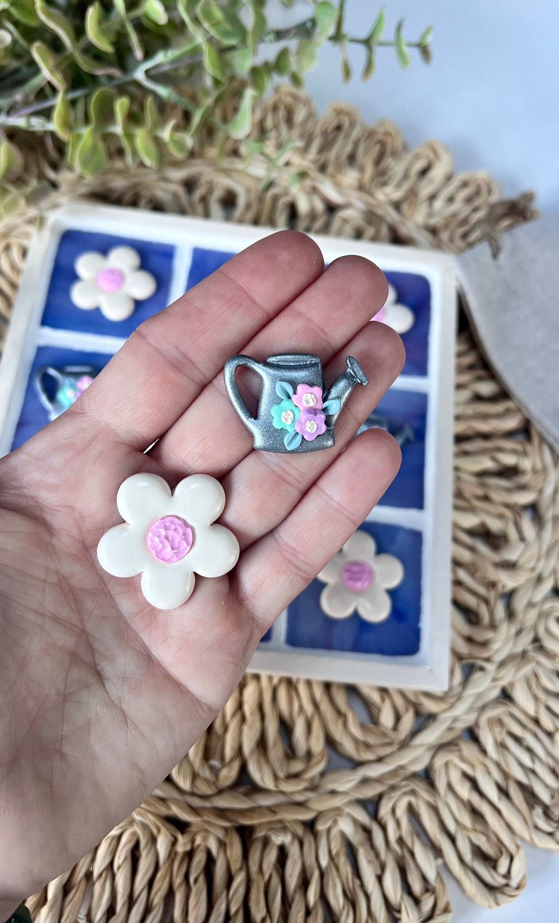 Stained glass tic tac toe board with watering can and daisy playing pieces