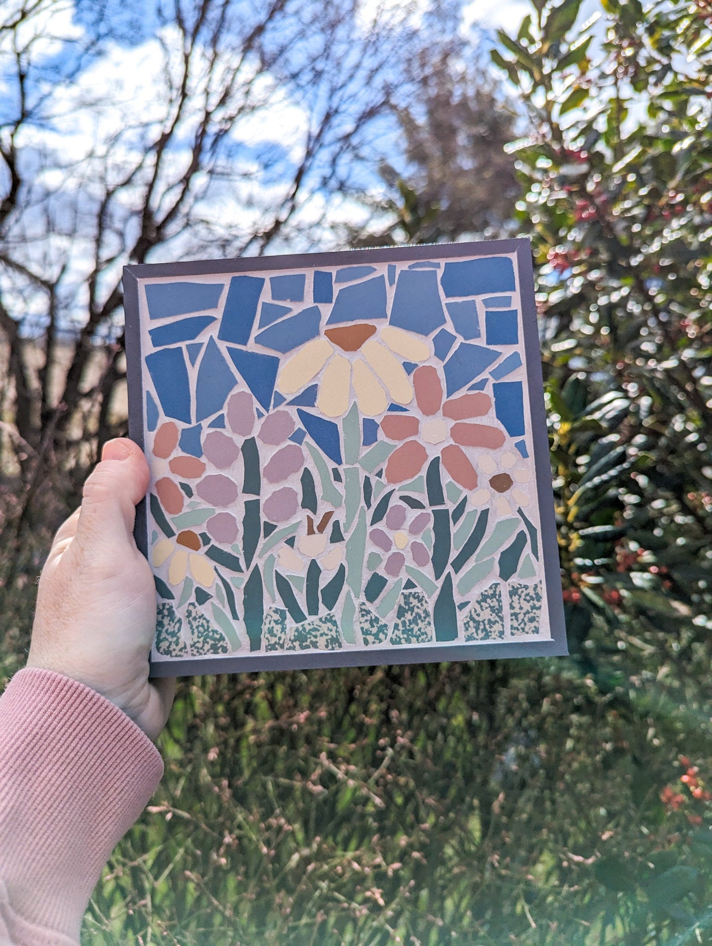 Floral mosaic set in a gray wooden frame featuring spring flowers in lavender, pink, yellow and off white