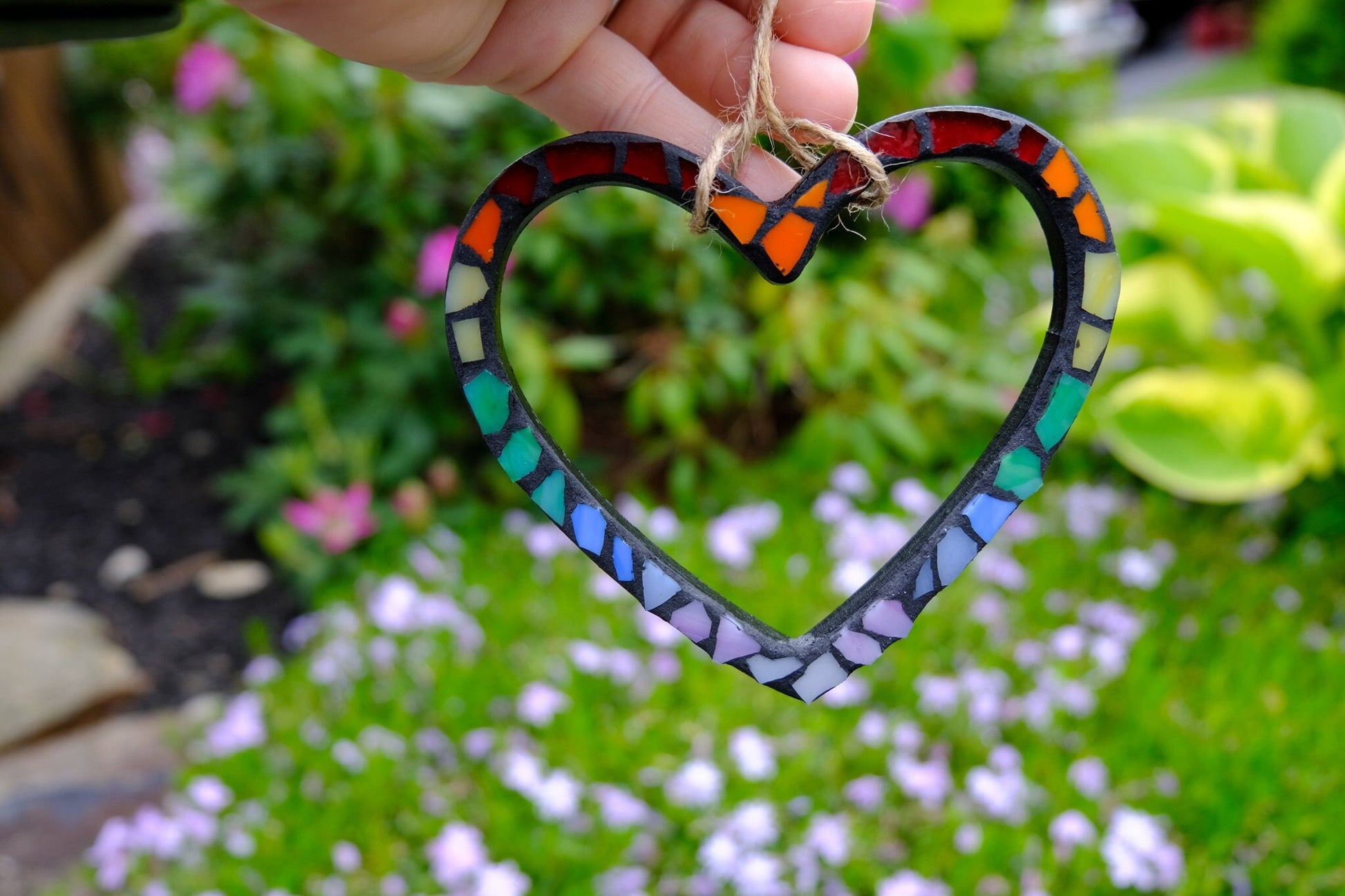 Stained glass rainbow mosaic heart ornament with black grout and jute cord hanger