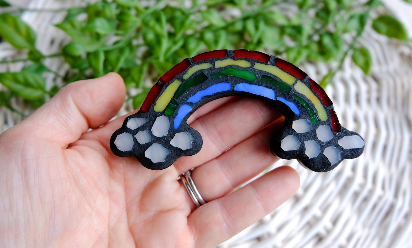 Stained glass mosaic rainbow with clouds and black grout