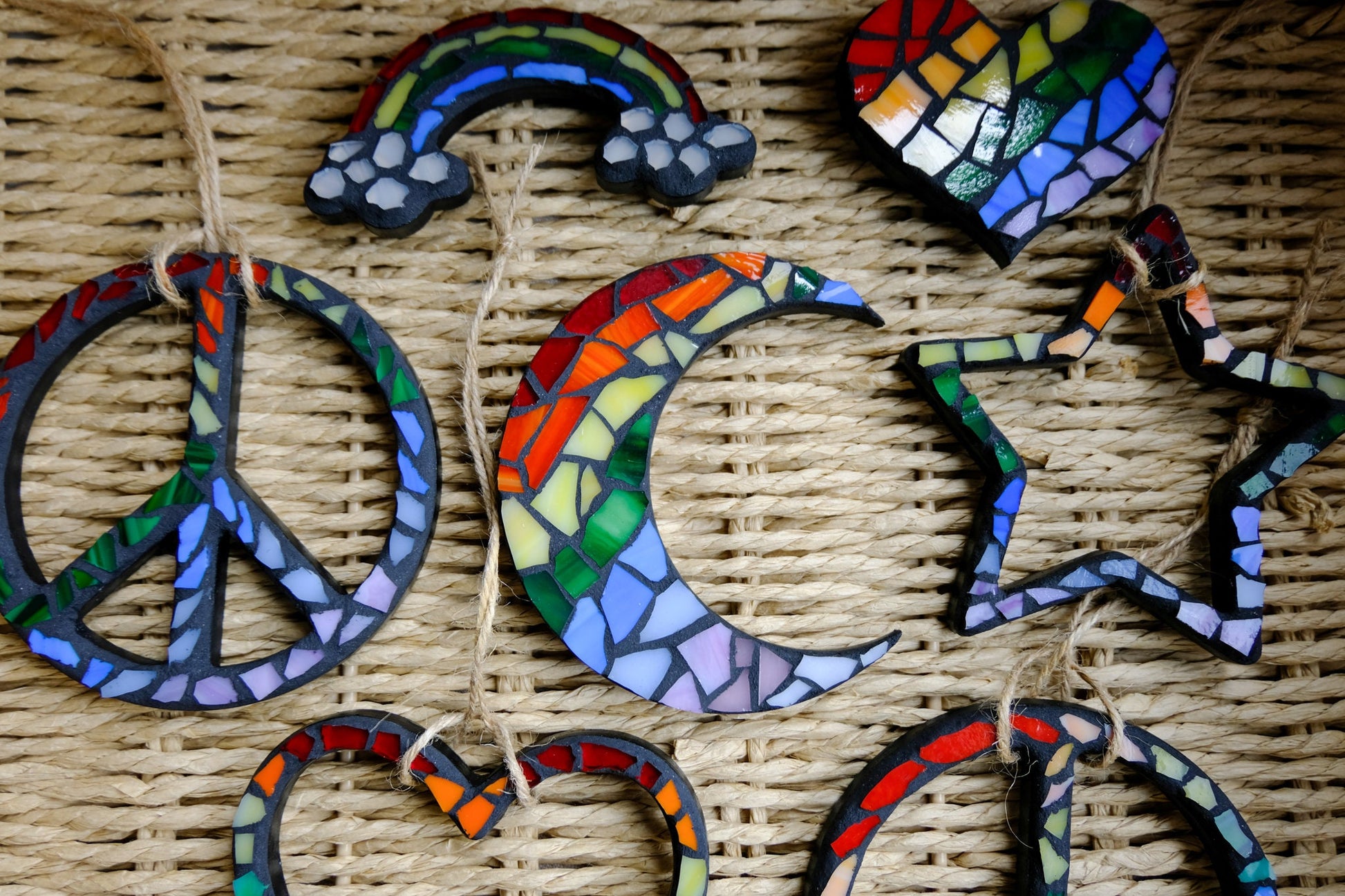 Stained glass mosaic rainbow with clouds and black grout